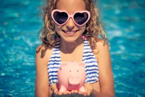 Happy child holding a toy pig | Learn everything about the cruise duck phenomenon